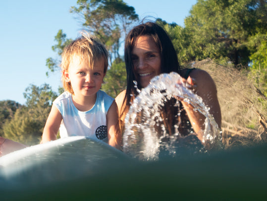 Me and my son Sam playing with my board in Noosa