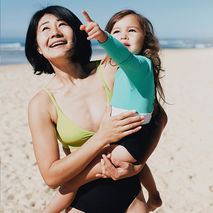 Kumi & Kaisa wearing Dkoko Kids Swimwear at the beach in the Sunshine Coast Australia