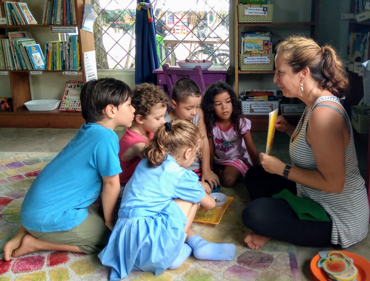 Teacher teaching about the environment to a group of children in Puerto Jimenez Costa Rica