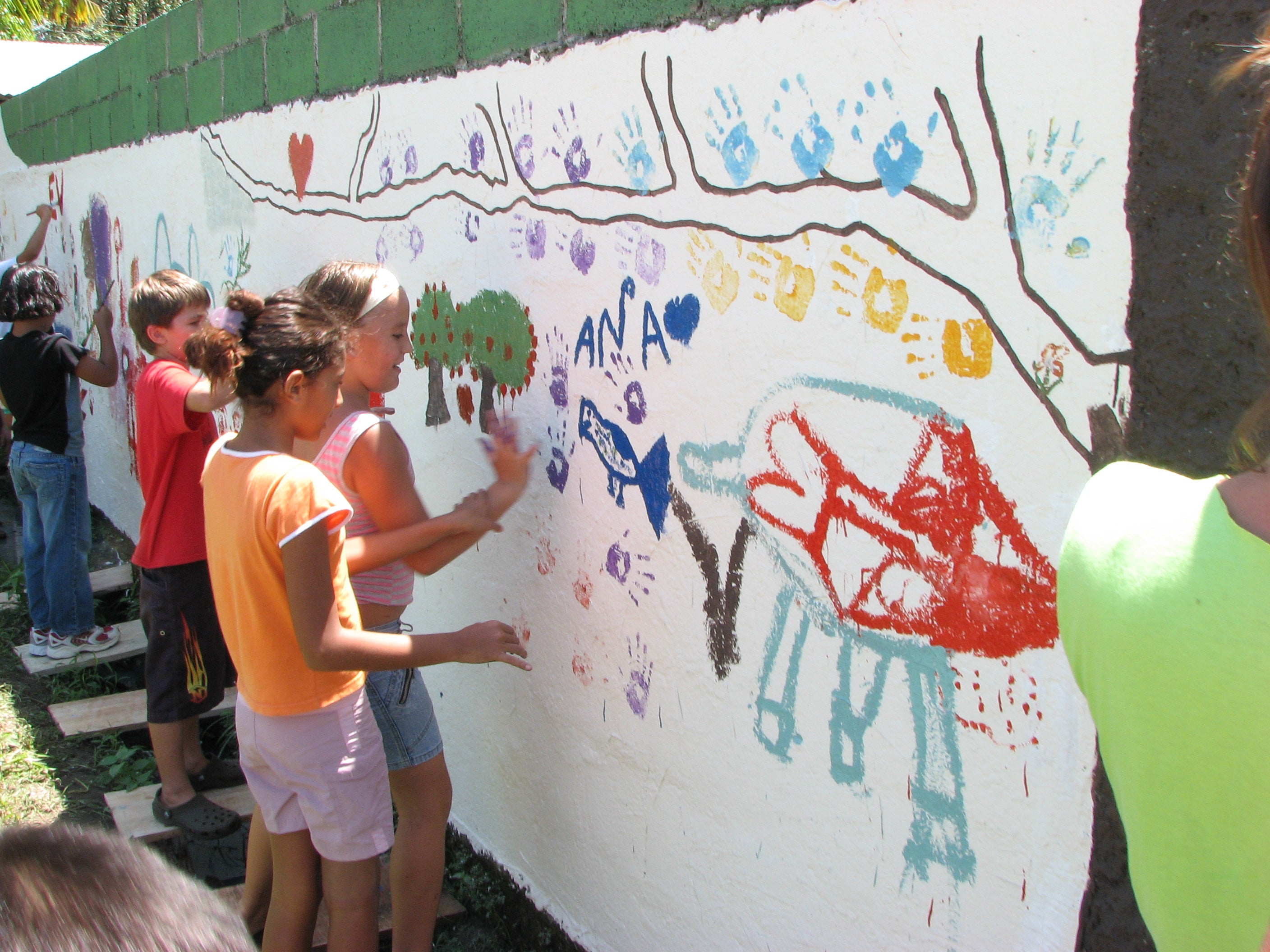 Kids paiting a mural in Ascona Community center in Puerto Jimenez Costa Rica